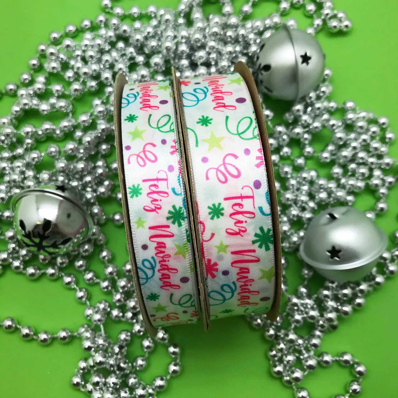 Feliz Navidad Ribbon with confetti and streamers in pink, green, blue and purple printed on 5/8" white single face satin